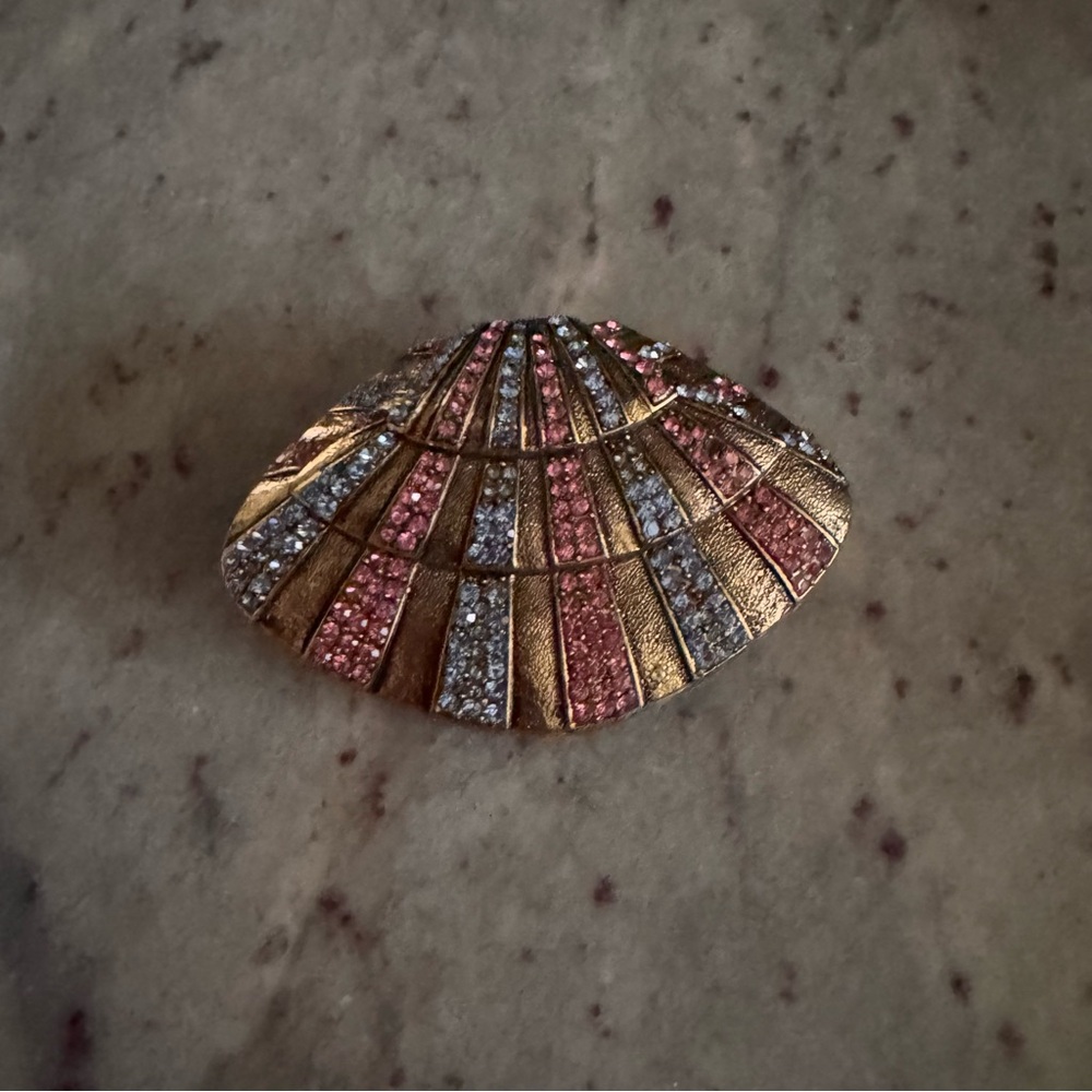 a gold multi gem-colored trinket box made without hinges when open